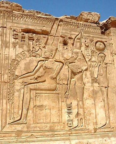 450px-Medinet_Habu_Ramses_III3_copyright Remih 2009_process,resize The Egyptian triad of Amun, Mut, and their son Khonsu (photo copyright Remih)